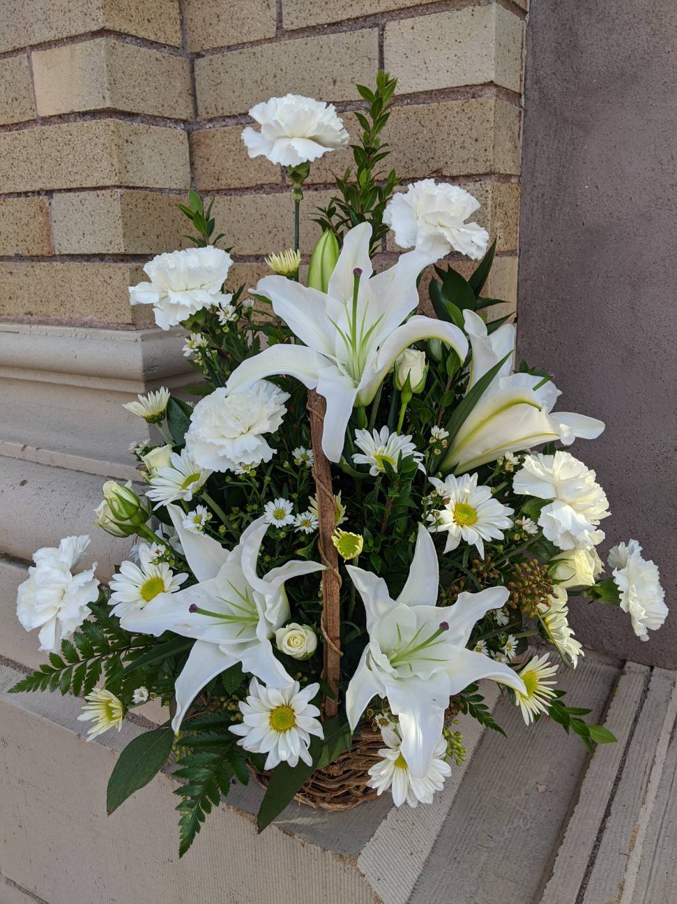 Serene White Lily Basket in Stanley, WI Ele's Flowers