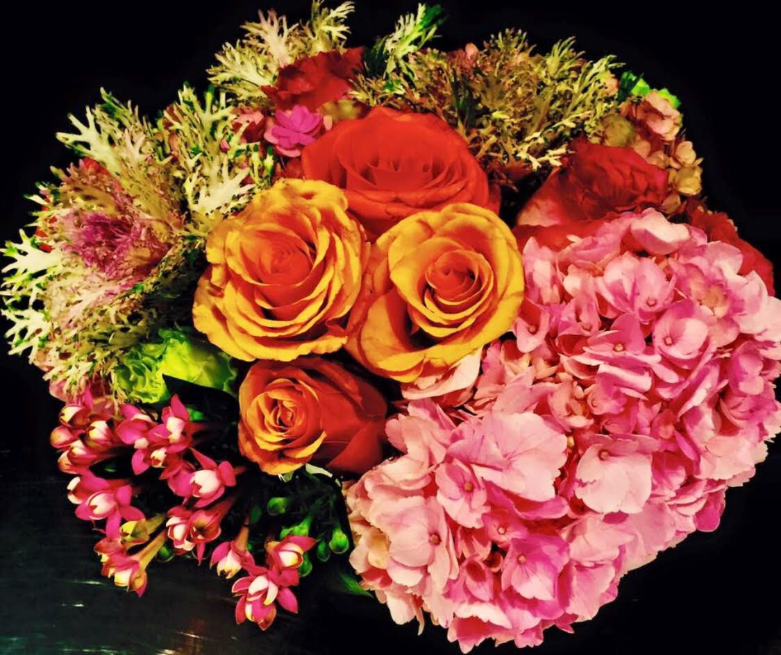 Dazzling Pizzaz Pozy Dazzling Pizzaz Pozy - Arrangement of oranges, reds, and pinks.