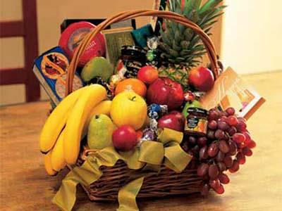  Fruit and Gourmet Basket - This beautiful wicker basket comes filled with fresh seasonal fruit and gourmet snacks. This basket comes wrapped in clear paper.