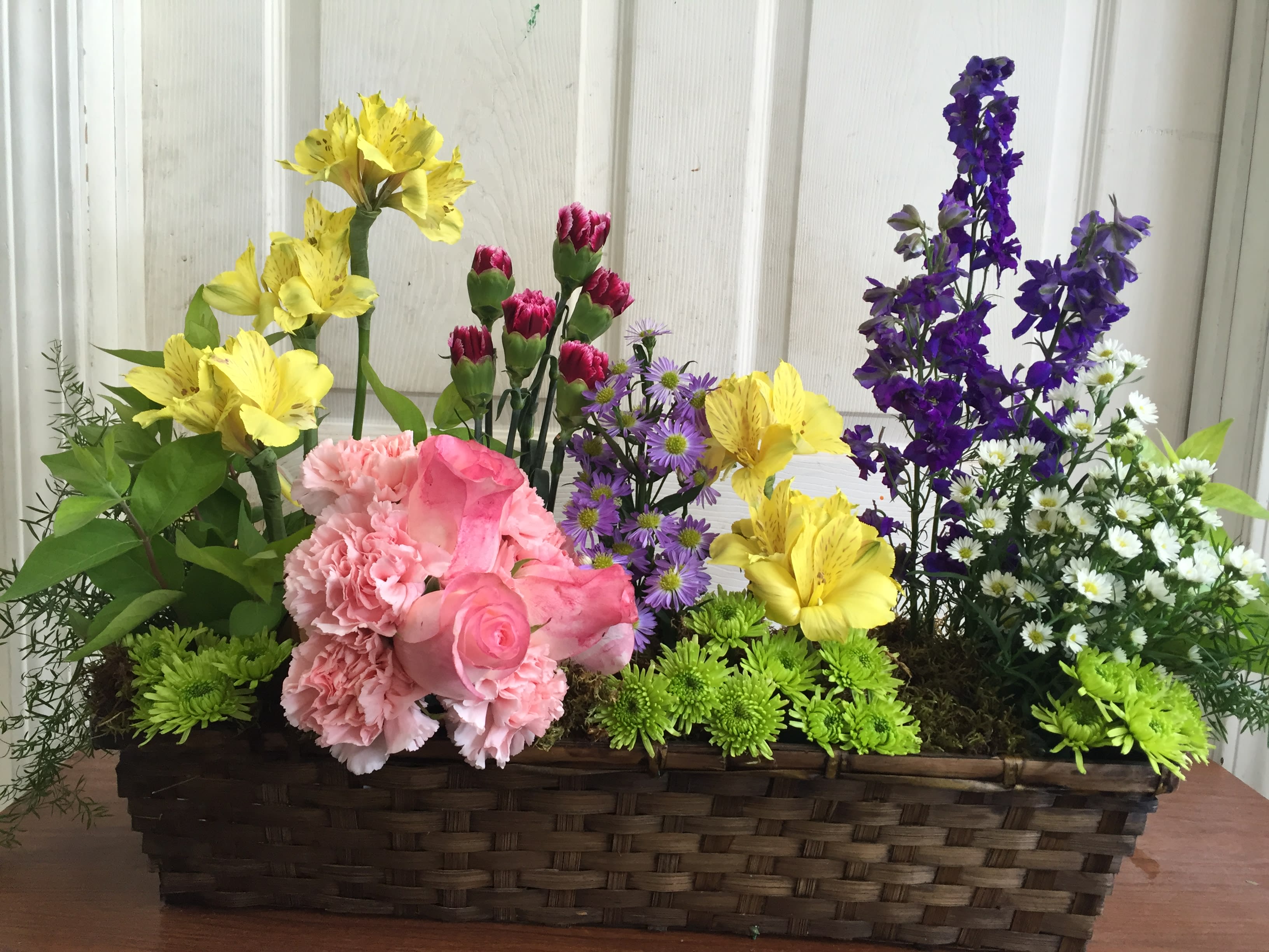 Spring Fling Spring Fling - Mix of spring staples arranged in a faux garden basket.