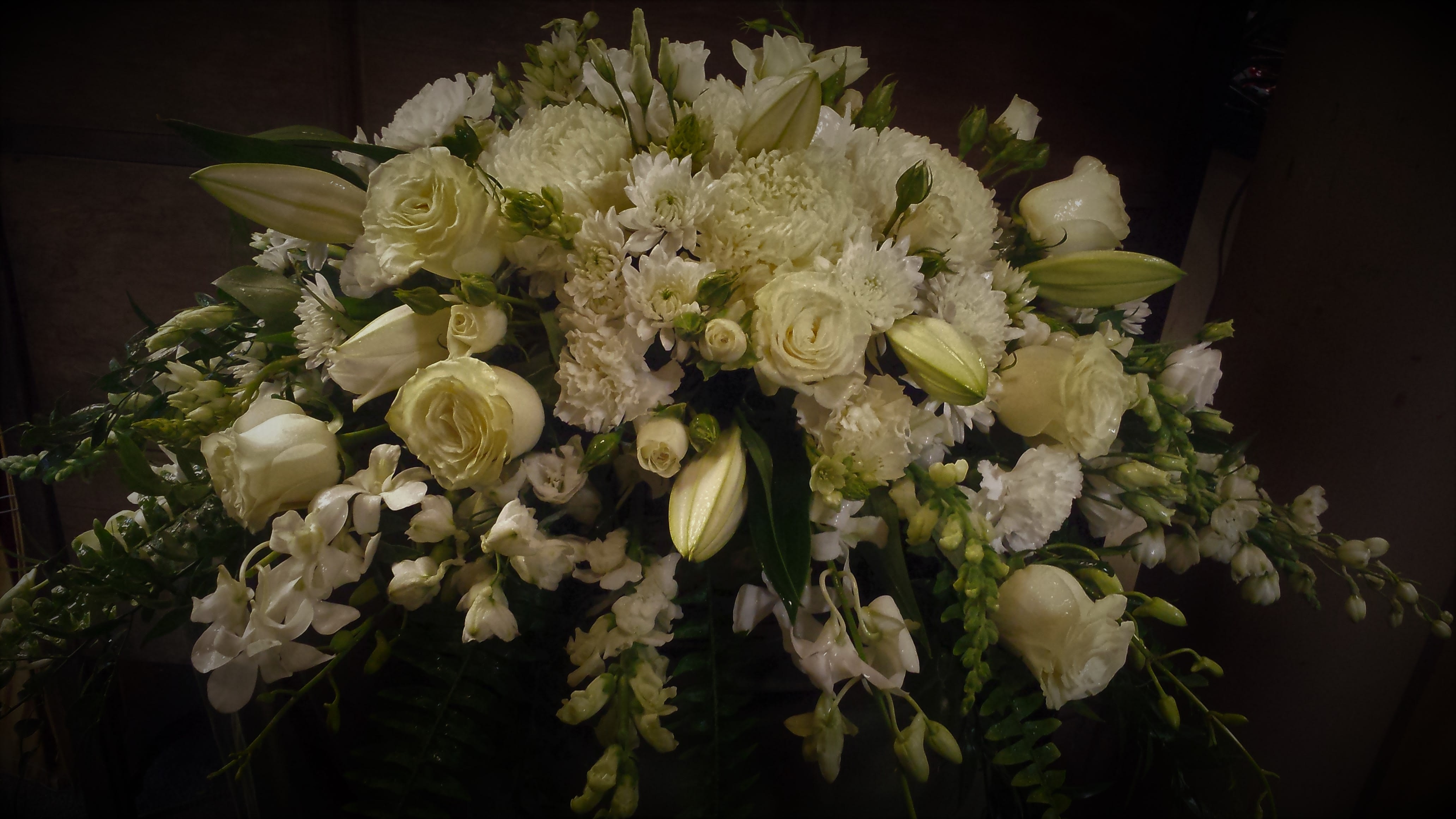 Pure Serenity Spray -  This all white casket spray will offer a tranquil feeling of Serenity.