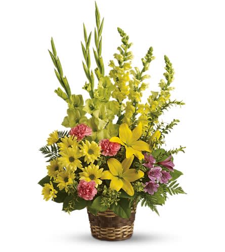 Vivid Recollections - This glorious basket of beautiful blossoms will send hope and let those you care for know that grief is a path they needn't walk alone. Bright flowers such as yellow asiatic lilies snapdragons and daisy spray chrysanthemums along with green gladioli purple alstroemeria and fresh greenery are beautifully delivered in a natural basket.Approximately 19&quot; W x 30&quot; H Orientation: One-Sided As Shown : T218-4A