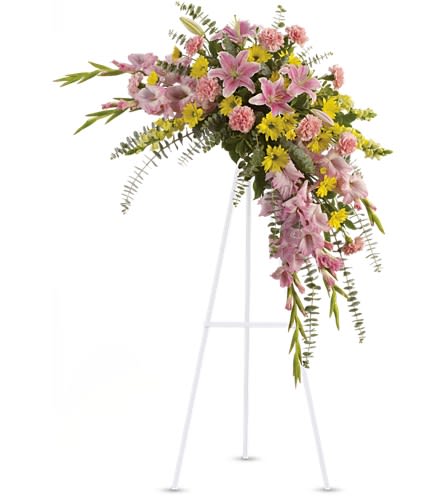 Sweet Solace Spray - Rejoice with this softly dramatic cascade of pink and yellow blooms - lilies gladioli and chrysanthemums - that has hints of eucalyptus and variegated greens. Stems of flowers such as pink lilies gladioli and carnations with yellow snapdragons and daisy spray mums accented by variegated greens and eucalyptus.Approximately 38&quot; W x 43&quot; H Orientation: One-Sided As Shown : T249-1A