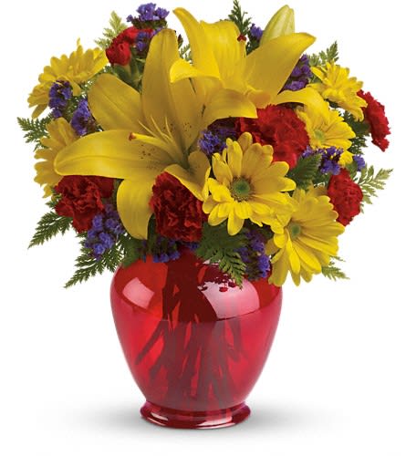 Teleflora's Let's Celebrate Bouquet - It's time to celebrate with bold bright flowers! Arranged in a charming red ginger jar vase this gorgeous gift of golden lilies and yellow daisies marks any occasion with pizzazz! This bright bouquet includes yellow asiatic lilies miniature red carnations yellow daisy chrysanthemums purple statice and fresh leatherleaf fern. Delivered in an exclusive red Ginger jar.Approximately 11&quot; W x 12 1/2&quot; H Orientation: One-Sided As Shown : TEV33-3ADeluxe : TEV33-3BPremium : TEV33-3C