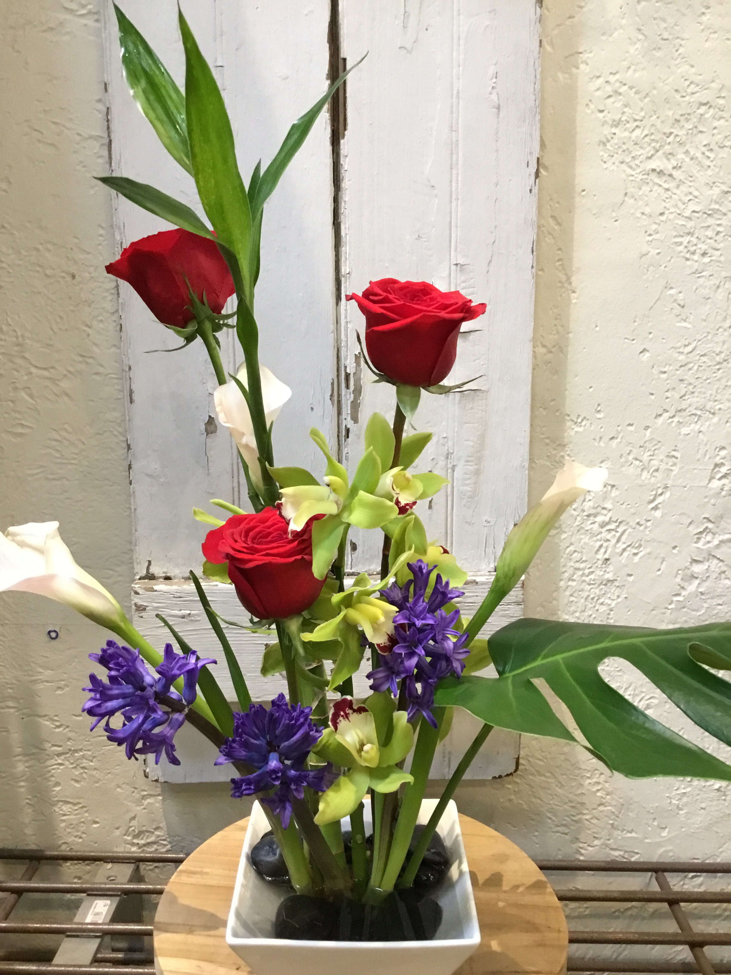 Iris, Roses, and Bells of Ireland Contemporary Piece - Centerville Florists