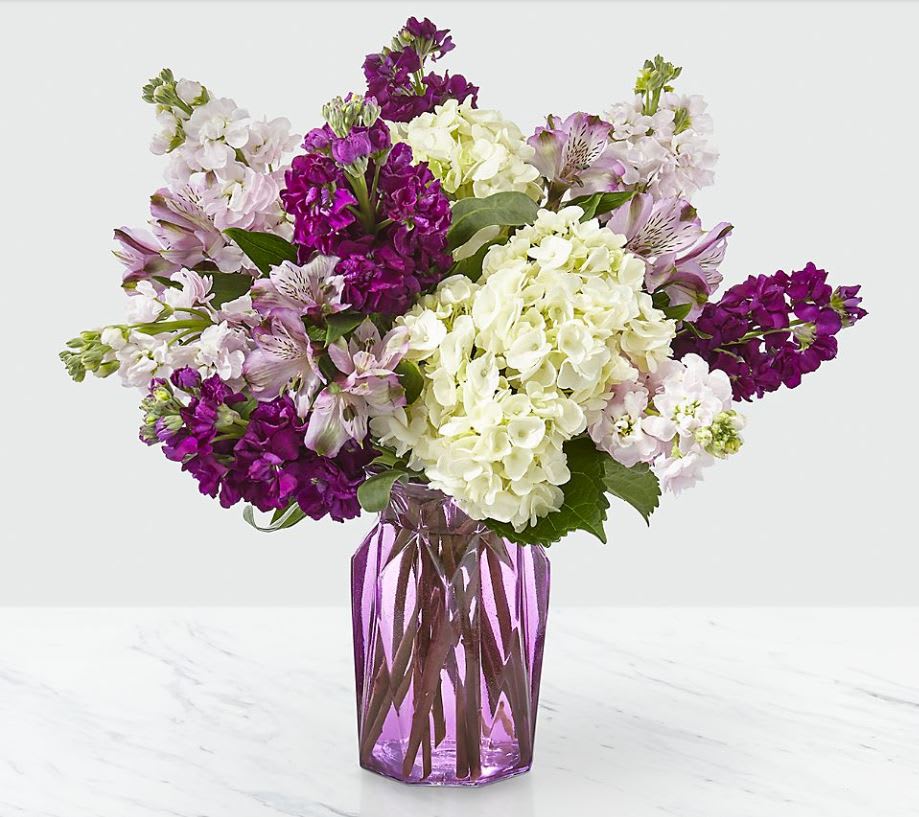 Violet Delight Bouquet - Looking to make their day? Well, look no further. Our Violet Delight™ Bouquet is designed with a stunning mix of pale pink and purple stock, hydrangea and alstroemeria. It 's gorgeous mix of blousy texture and charming hues make it perfect for complementing any occasion!