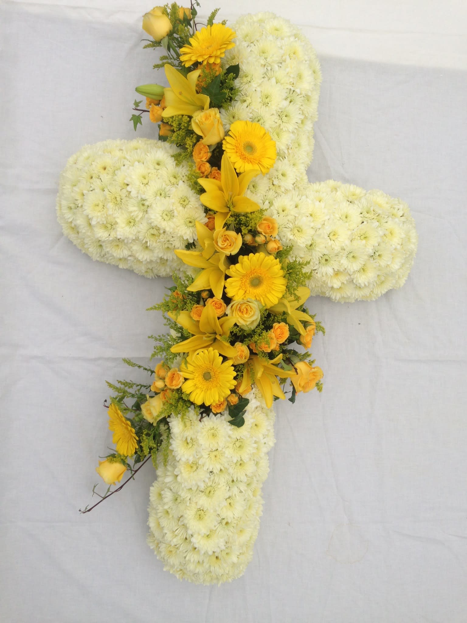 Simple Eleagance cross - Standing 36&quot; cross with white poms and an array of yellow flowers