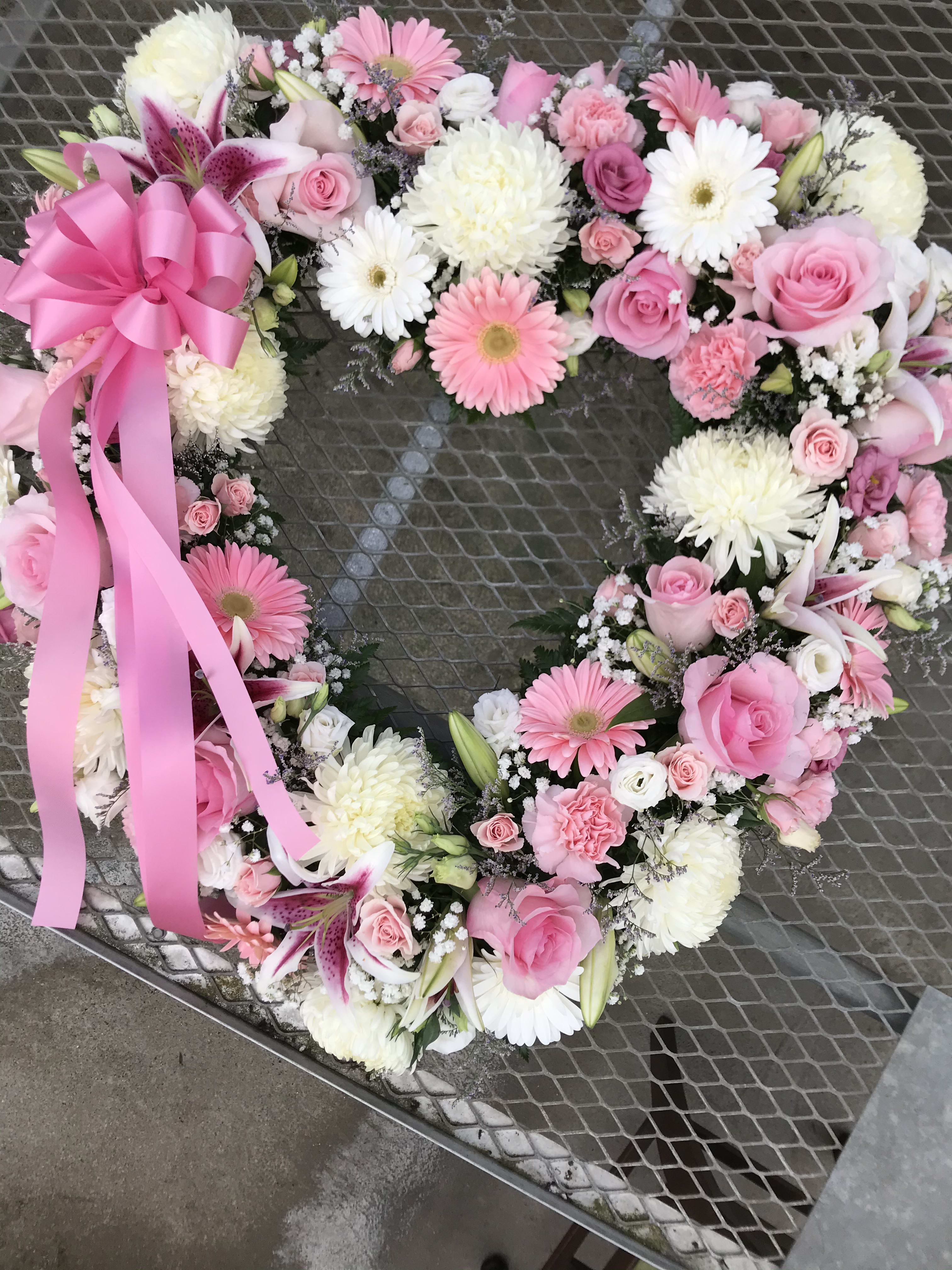Standing open heart - Open heart filled with white and pink flower.
