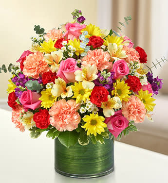 Cherished Memories - Multicolor Bright - Product ID: 95438   Express your condolences with our truly original sympathy arrangement of bright and beautiful roses, stock, alstroemeria, carnations and more. Designed by our florists to offer comfort to friends and family during difficult times of loss. Graceful, bright-toned arrangement of roses, stock, alstroemeria, carnations, daisy poms, mini carnations and monte casino, gathered with variegated pittosporum and spiral eucalyptus Hand-designed by our expert florists in a stylish clear glass cylinder vase wrapped with a Ti leaf ribbon; vase measures 6&quot;H Appropriate for the service or the home of friends and family members Large arrangement measures approximately 16&quot;H x 17&quot;L Medium arrangement measures approximately 15&quot;H x 16&quot;L Small arrangement measures approximately 14&quot;H X 15&quot;L Our florists hand-design each arrangement, so colors, varieties, and vase may vary due to local availability