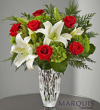 Marquis by Waterford Holiday Arrangement Marquis by Waterford Holiday Arrangement - Product ID: 107986 Here's a sparkling new surprise to celebrate the holidays! Our expert florists skillfully arrange elegant white lilies, rich red roses and lush mini green hydrangeas inside this stunning Marquis by Waterford® crystal vase, which lets their vibrant beauty shine through. With its exquisite design and detail, this handcrafted keepsake gift is one they can display all throughout the year. Fresh holiday bouquet of red roses, white lilies and mini green hydrangeas accented with assorted Christmas greens, berzelia and myrtle Lilies may arrive in bud form and will open to full beauty over the next 2-3 days Marquis by Waterford® keepsake crystal vase, handcrafted and featuring heavy, vertical cuts inspired by tropical rain showers; measures 9"H Arrives with a Waterford®/1800Flowers® gift box (where available) Large measures approximately 23"H x 18"L Medium measures approximately 22.5"H x 17"L Small measures approximately 22"H x 16"L Our florists hand-design each arrangement, so colors and varieties may vary due to local availability