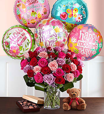 Only the Best for Mom Only the Best for Mom - Someone who loves with all her heart deserves to feel that same love… especially on Mother’s Day. We’ve hand-arranged 50 timeless roses in striking shades of red, pink and lavender inside a stylish cylinder vase, creating the ultimate surprise for Mom. And because one amazing gift deserves another (and another…and another!), these gorgeous blooms are paired with a plush bear, chocolates and festive balloons! Our florists hand-design each arrangement, so colors, varieties and container may vary due to local availability All-around arrangement of 50 roses in red, light pink, hot pink and lavender; accented with pink limonium, aspidistra leaf and variegated pittosporum Artistically designed in a clear glass cylinder vase