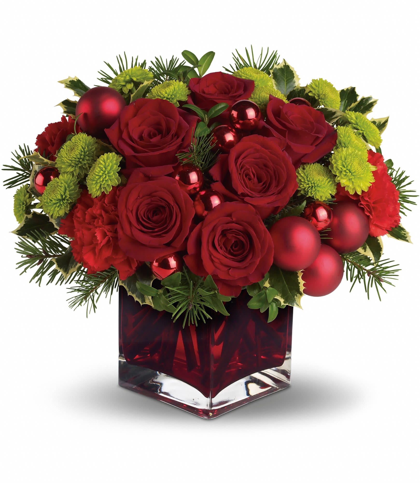 Merry & Bright Merry & Bright - You may not be able to guarantee a white Christmas, but with elegant touches like stunning red roses mixed with ornament balls and douglas fir, you can be assured of sending a merry and bright one! Gorgeous red roses and carnations along with brilliant green button chrysanthemums, shiny red ornament balls and winter greens are perfectly arranged in this very merry Christmas cube. Approximately 13" W x 11 1/2" H Orientation: One-Sided