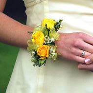 Summertime corsage Summertime corsage - Different shade of yellows and white accents.