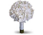 Gardenia and Grace Bouquet - T187-1A - Beloved for their enchanting fragrance gardenias are gathered with hydrangea and roses into an elegant white bouquet. Gardenias and hydrangea are paired for a stunning all-white bouquet.Approximately 10&quot; W x 13 1/2&quot; H Orientation: N/A As Shown : T187-1A