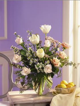 Floral Pastels Floral Pastels - Such a subtle yet powerful way to express your feelings. It's like sending love. White tulips, pink roses and more. Approximately 14"H x 14"W