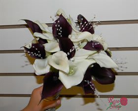 White and Eggplant Bride Bouquet White and Eggplant Bride Bouquet - 20 selected minni Calla Lilies in a lovely bouquet. accent with pearls. 13"H x 10"W x 10"D.