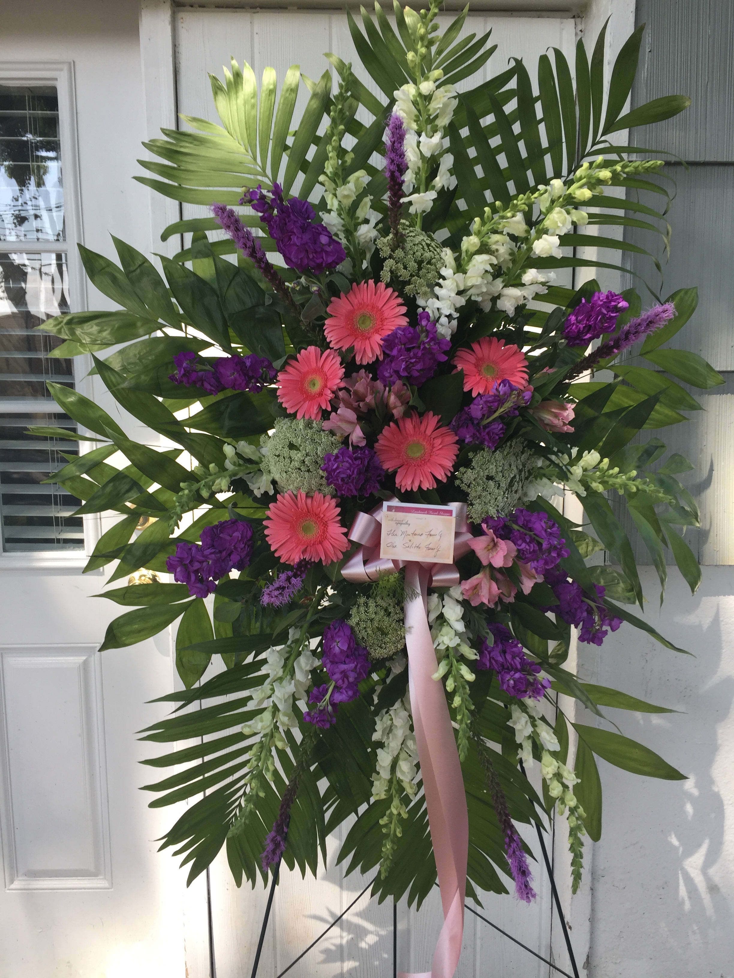 Standing Spray Pink &amp; Purple  - Pink gerbera daisies, white snap dragon, purple stock, liatris, white filler and premium greens. 