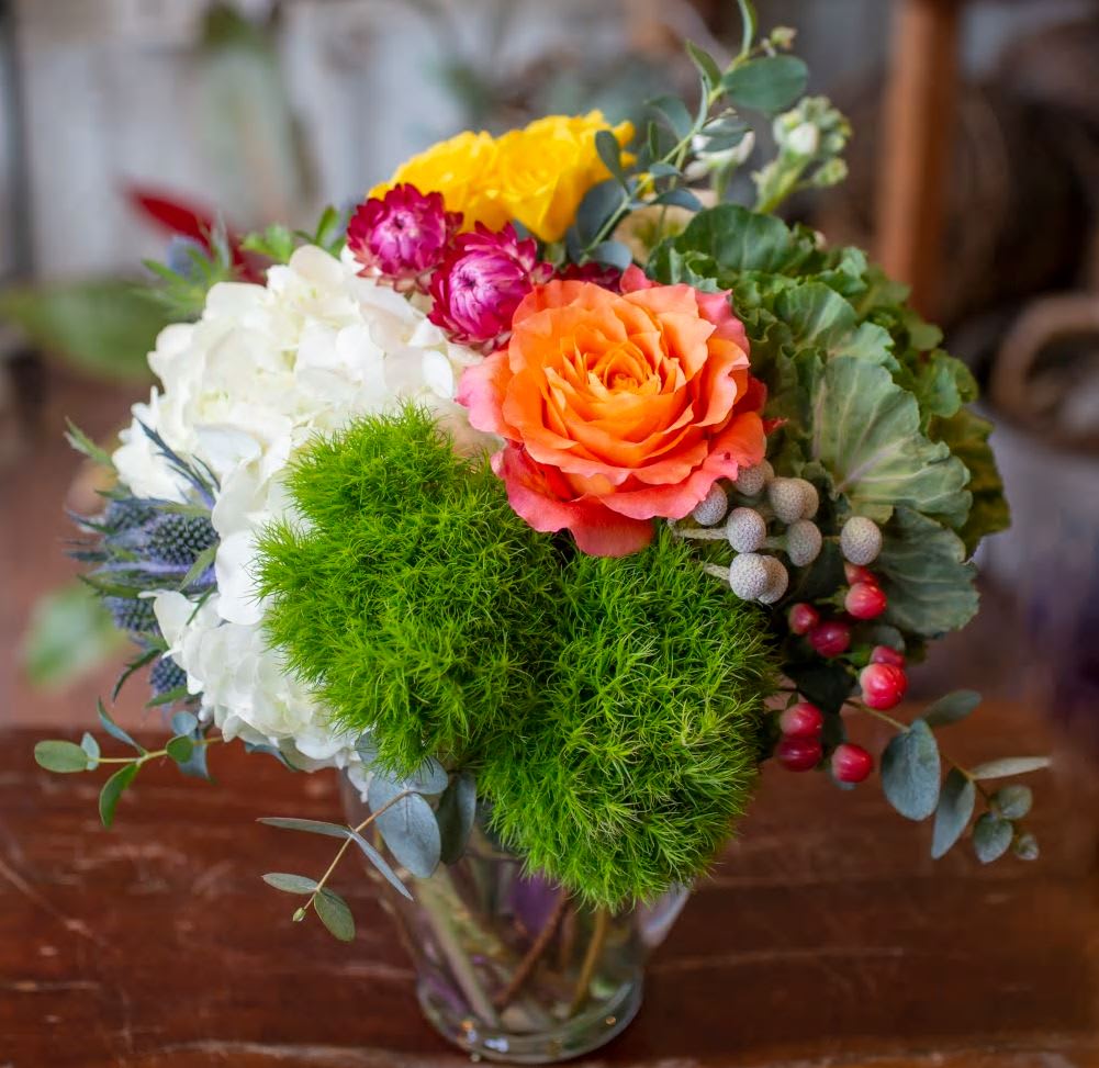 dianthus cabbage - hydrangeas, green dianthus , purple cabbage in a round vase