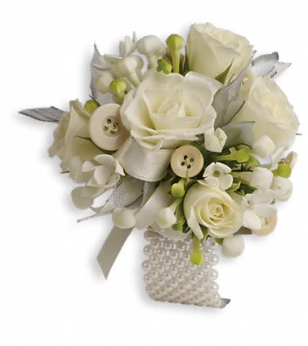 All Buttoned Up Corsage All Buttoned Up Corsage - Delight them all with this romantic arrangement of white blooms and whimsical buttons. White bouvardia and white spray roses with button accents.Approximately 4 1/2" W x 4 1/2" H Orientation: N/A As Shown : TPR14-2A