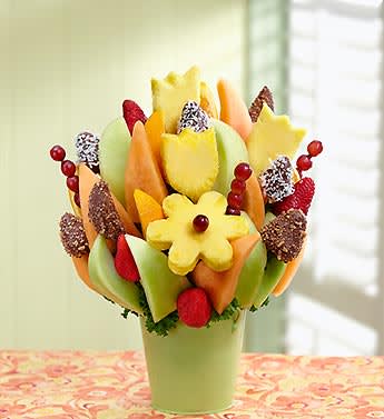 Fresh &amp; Fabulous - Product ID: 94934  Make any day a celebration with this fabulous fruit creation! Expertly arranged in a reusable green tin, it's loaded with delicious dipped apples and strawberries rolled in crunchy toffee or coconut, flower-shaped pineapple slices, melon wedges, orange wedges and grapes. A truly original way to send smiles for birthdays, congratulations or &quot;just because&quot; you think they're sweet. Fresh fruit arrangement includes dipped strawberries rolled in coconut or toffee, dipped apple wedges rolled in toffee, honeydew melon and cantaloupe wedges, tulip-shaped pineapple slices, daisy-shaped pineapple slices with grape centers, orange wedges, strawberries and grape skewers All of our dipped fruit is covered in delicious chocolaty confections Hand-crafted and designed by local shops Arrives in a reusable green tin container with lettuce and kale base; measures 4.75&quot;H Delivered fresh to their door with Same-Day Delivery Arrangement measures 16&quot;H x 13&quot;D Allergy Warning: Fruit Bouquets products may contain peanuts and/or tree nuts. We recommend that you take the necessary precautions based on any related allergies.