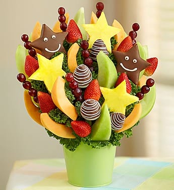 Just To See You Smile - Product ID: 102245  Send a bunch of smiles with this sweet and satisfying Fruit Bouquet! Itâs perfect for family gatherings, anniversaries, or birthday surprises. Juicy strawberries, dipped strawberries with white swirls, star-shaped pineapple slices dipped and decorated with a smiley face, star-shaped pineapple slices, honeydew melon and cantaloupe wedges, grape skewers and more Hand-crafted and designed by local florists Arrives in a reusable green tin container that complements any nursery dÃ©cor; measures 4.75&quot;H Delivered fresh to their door with Same-Day Delivery Arrangement measures 18&quot;H x 14&quot;D