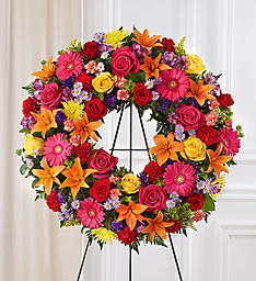 Elegant Multi Color Wreath - Elegantly designed with seasonal flowers with burst of difference colors