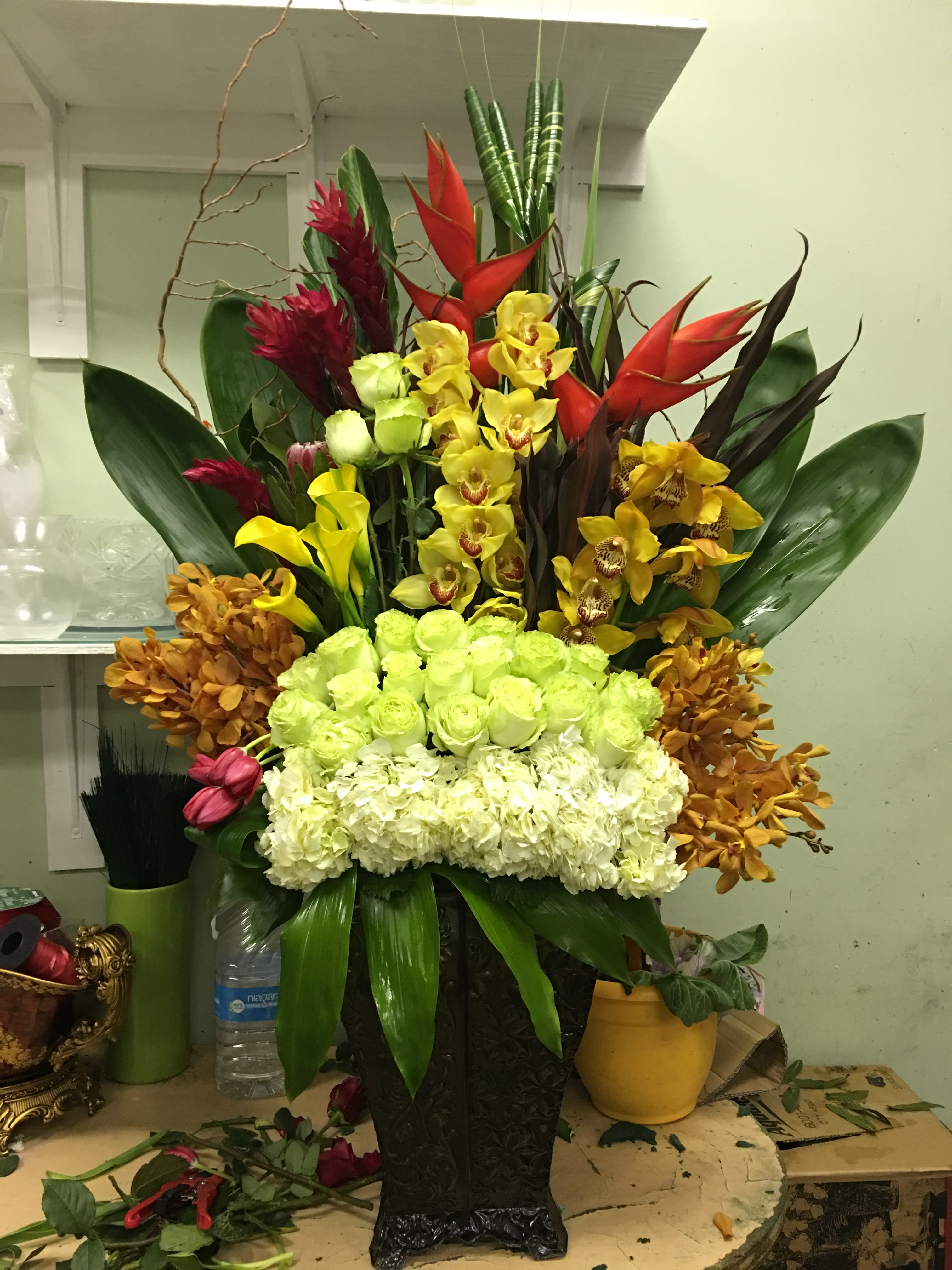 Tropical Paradise - Roses, Orchids, Ginger, Hydrangea Colors: Red, Green, Orange, Yellow, White.