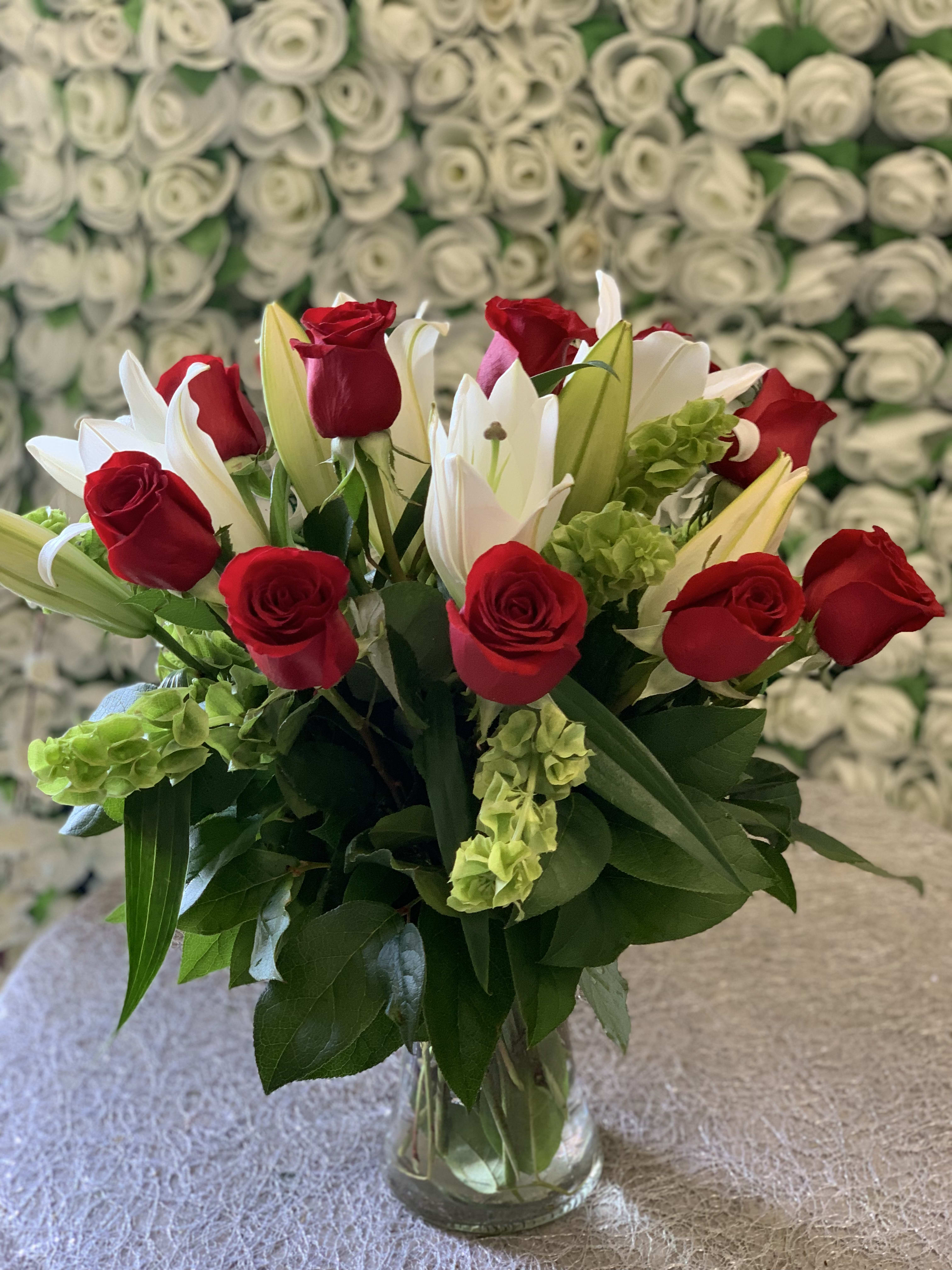 Bells of Rose &amp; Lilies  - Bells of Ireland; Red roses and white lilies in a gathering vase