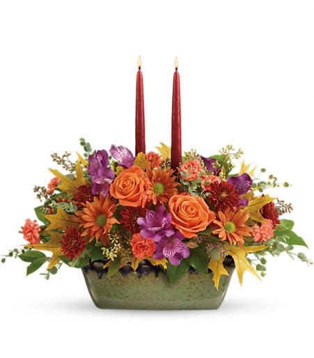Teleflora's Country Sunrise Centerpiece Teleflora's Country Sunrise Centerpiece - Like a beautiful fall sunrise, this bright bouquet will warm their hearts, while the hand-glazed, oven-to-table stoneware serving dish will grace their table for many years to come!