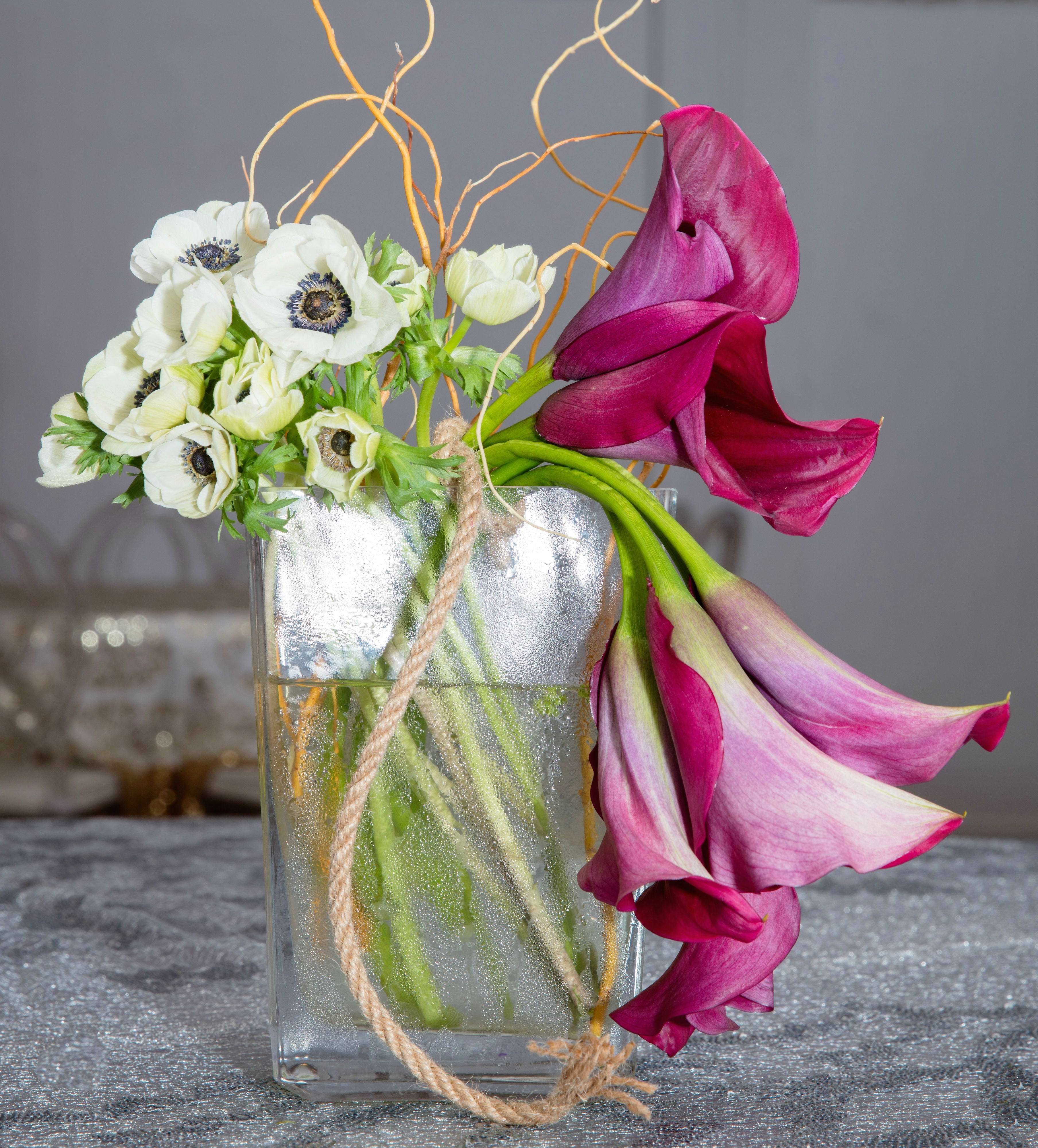 Deep Love Deep Love - Composed of Anemone, Curly Willow, Cala Lilies.
