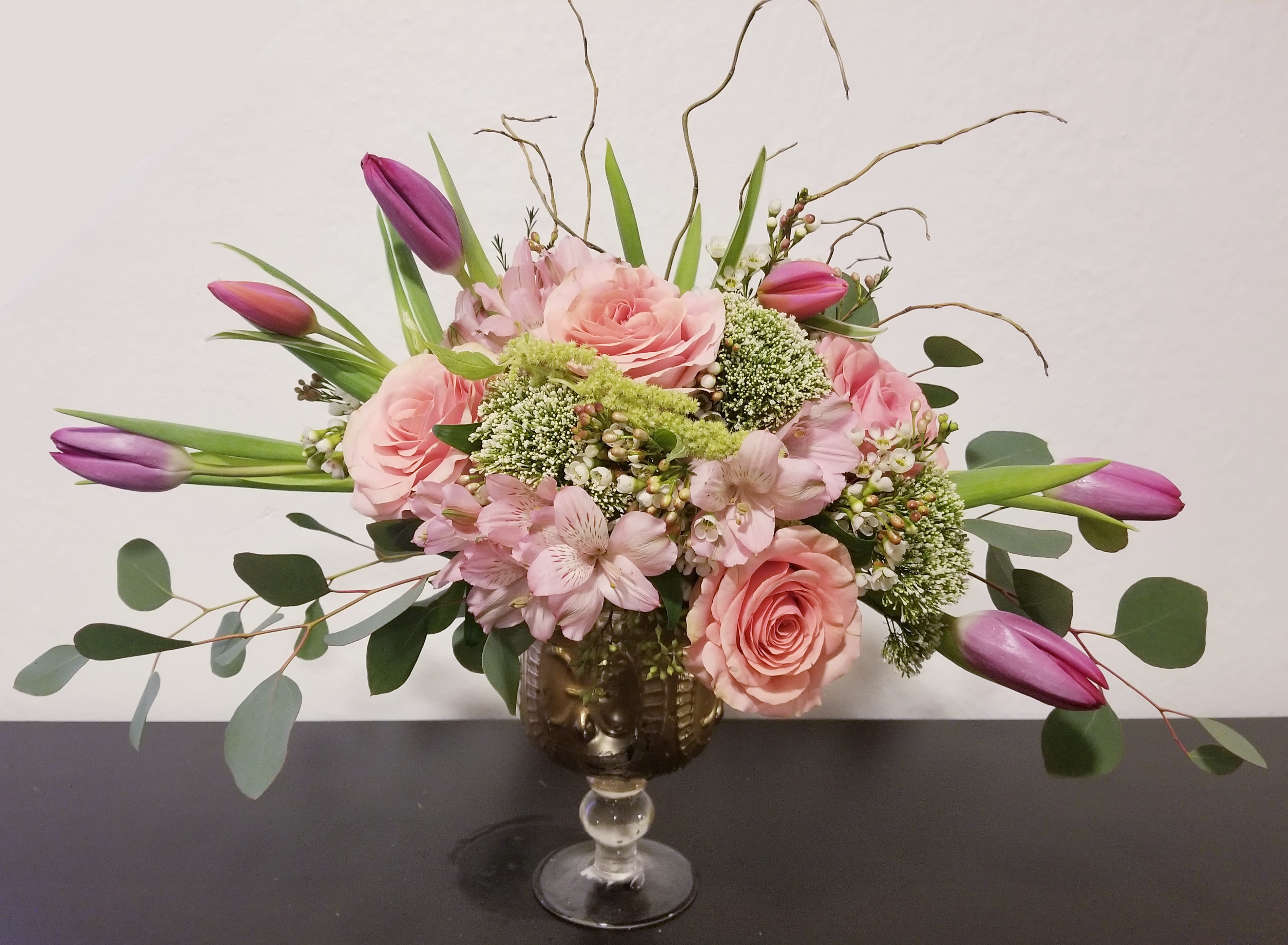 Pink Beauty Pink Beauty - Composed of roses, tulips, green mist, curly willow, variety of green.
