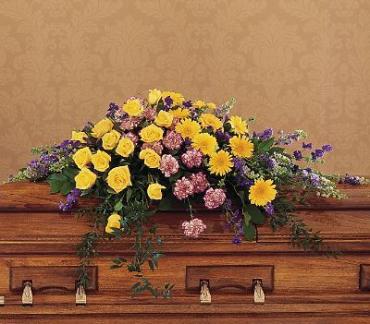 Eternal Casket Spray -  Yellow roses, variegated purple carnations, purple larkspur and soft foliage bring eternal hope in this delicately hand-arranged casket spray. Same-day delivery.      One half-couch casket spray arrives filled with yellow roses and gerberas, purple larkspur, variegated purple carnations and soft foliages.     Approximately 60&quot; W x 16&quot; H  