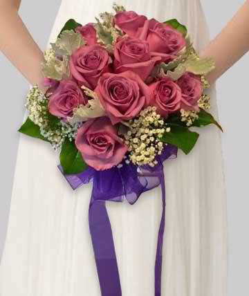 Dusty Rose Bouquet - A beautiful nosegay style bouquet featuring dusty pink roses, dusty miller, and baby's breath.  Substitutions of equal or greater value may be made depending on season and availability of product or container. 