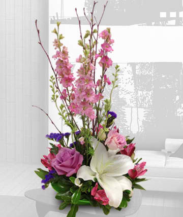 Yours Truly Yours Truly - Stylish arrangement in pinks and purples, featuring white stargazer lily Substitutions of equal or greater value may be made depending on season and availability of product or container.