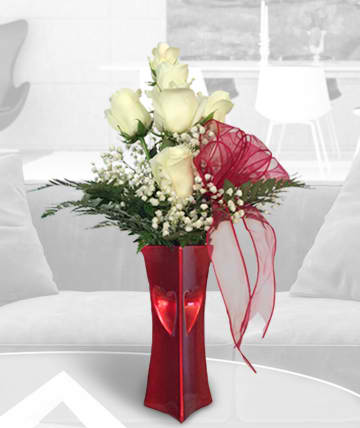 Two Hearts Bouquet Two Hearts Bouquet - Beautifully styled glowing red ceramic vase with two hearts arranged with white roses and baby's breath Components may vary