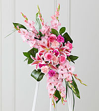 The FTD Sweet Farewell Spray - When your feelings of loss and sorrow compel you to make a grand gesture of sympathy, this dramatic, standing arrangement is a lovely way to convey your sincerest condolences. This extraordinary composition of pink blooms and lush greens handcrafted by an FTD artisan florist includes roses, carnations, gladiolus and Stargazer lilies set among lush, contrasting greenery. Made to be displayed on an easel, it makes an appropriate choice for a wake, funeral or graveside service, sure to be much appreciated and long remembered. Approximately 37&quot;H x 20&quot;W. 