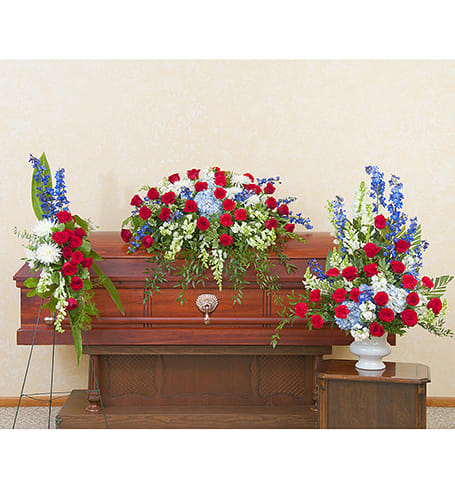 Honor Trio - A patriotic casket spray, standing spray, and urn.