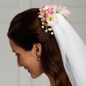  The FTD® Celestial™ Hair Décor  -  The FTD® Celestial™ Hair Décor is a wonderful way to add that extra touch to your veil. Beautiful Lily of the Valley, fragrant hyacinth and blush Dendrobium Orchids are brought together to form an exquisite hair accessory to make you look your bridal best.    SKU#: W15-4652 