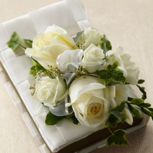  The FTD® Rose Charm™ Bouquet  -  The FTD® Rose Charm™ Bouquet is the perfect bridal gift on the wedding day. An incredible bouquet of white roses, freesia, spray roses and lush greens are elegantly arranged on top of a bible accented with a basket weave pattern of white satin ribbon. A gift they will always hold dear.    SKU#: W8-4635 