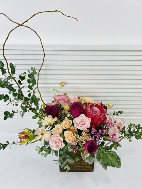 A bit of fragrance  - A Modern arrangement of vivid mix of flowers in a wooden box