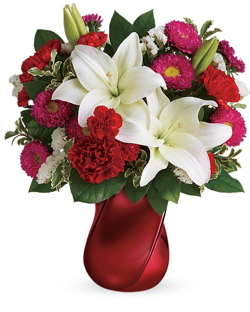 Teleflora's Always There Bouquet - Let them know that you&#039;ll always be there with this breathtaking red and white bouquet hand-delivered in a unique ceramic vase with modern twisted design. White asiatic lilies red carnations red miniature carnations hot pink matsumoto asters and white sinuata statice are accented with pitta negra and lemon leaf. Delivered in a Mad Crush Vase.