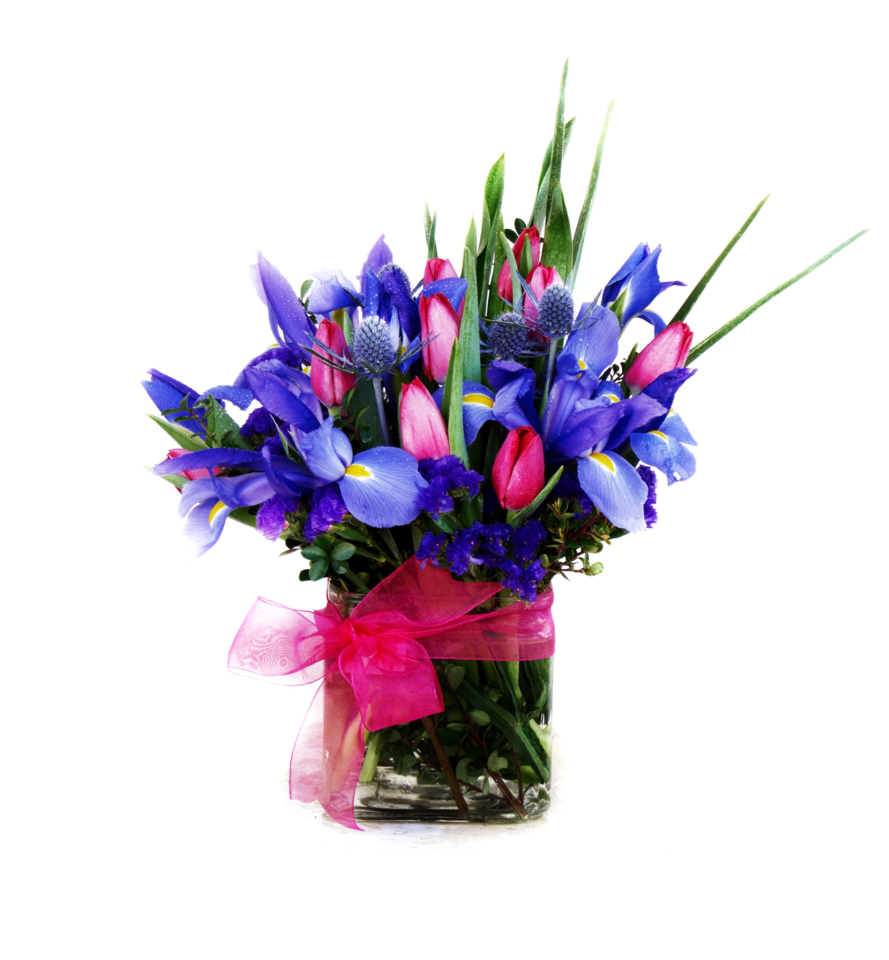 Spring Sky - Pretty design including iris, tulip and accents in a nice vase. STANDARD: FIRST PHOTO DELUXE: SECOND PHOTO