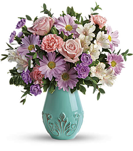 Teleflora's Blushing Aqua Bouquet - Springy and stylish, this blushing mix of soft pink roses with white and lavender blooms finds a fresh counterpart in this stunning aqua-glazed ceramic vase with distressed, vintage detailing! This blushing bouquet features light pink roses, light pink alstroemeria, pink carnations, miniature lavender carnations, lavender daisy spray chrysanthemums, parvifolia eucalyptus, and variegated pittosporum. Delivered in an Aqua Dream Vase. Approximately 16 1/2&quot; W x 17 1/2&quot; H 