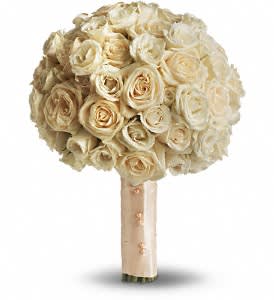 Blush Rose Bouquet Blush Rose Bouquet - Add a classic touch to your special day with this simply gorgeous bouquet of crème roses, wrapped with creamy satin ribbon. A generous bouquet of crème roses bound with a satin ribbon. Approximately 10" W x 13" H Orientation: N/A