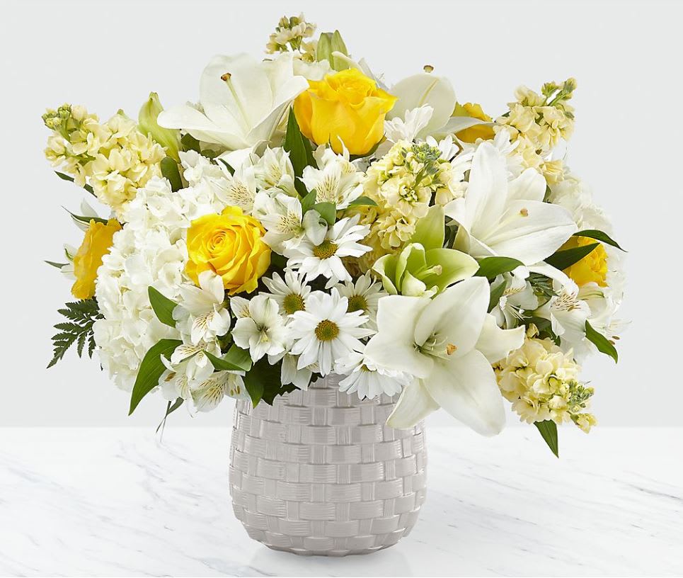 Comfort and Grace™ Bouquet Comfort and Grace™ Bouquet - Our Comfort and Grace™ is elegantly crafted by our passionate and dedicated local florists to compliment your heartfelt sympathies. A collection of roses, stock, hydrangea and lilies is a timeless gift to share during times of sensitivity. While the lilies initially come in bud form, they beautifully transform into flowers as they open. Good bouquet is approx. 17"H x 18"W. Better bouquet is approx. 18"H x 20"W. Best bouquet is approx. 20"H x 22"W.