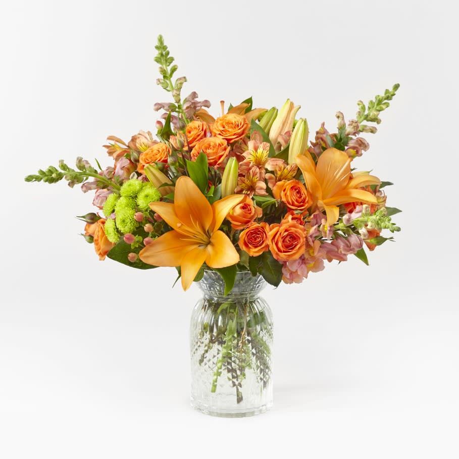 The FTD® Fresh &amp; Rustic™ Bouquet  - With all the things to love about Autumn, this bouquet tops the list. This arrangement features orange and peach blooms with assorted greens.