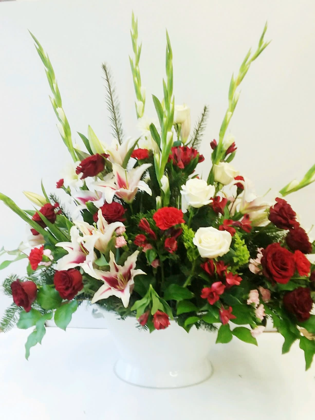 Grand Gesture - When you really want to make a grand gesture! A beautiful full arrangement filled with red roses, stargazer lilies, gladiolus, carnations and more