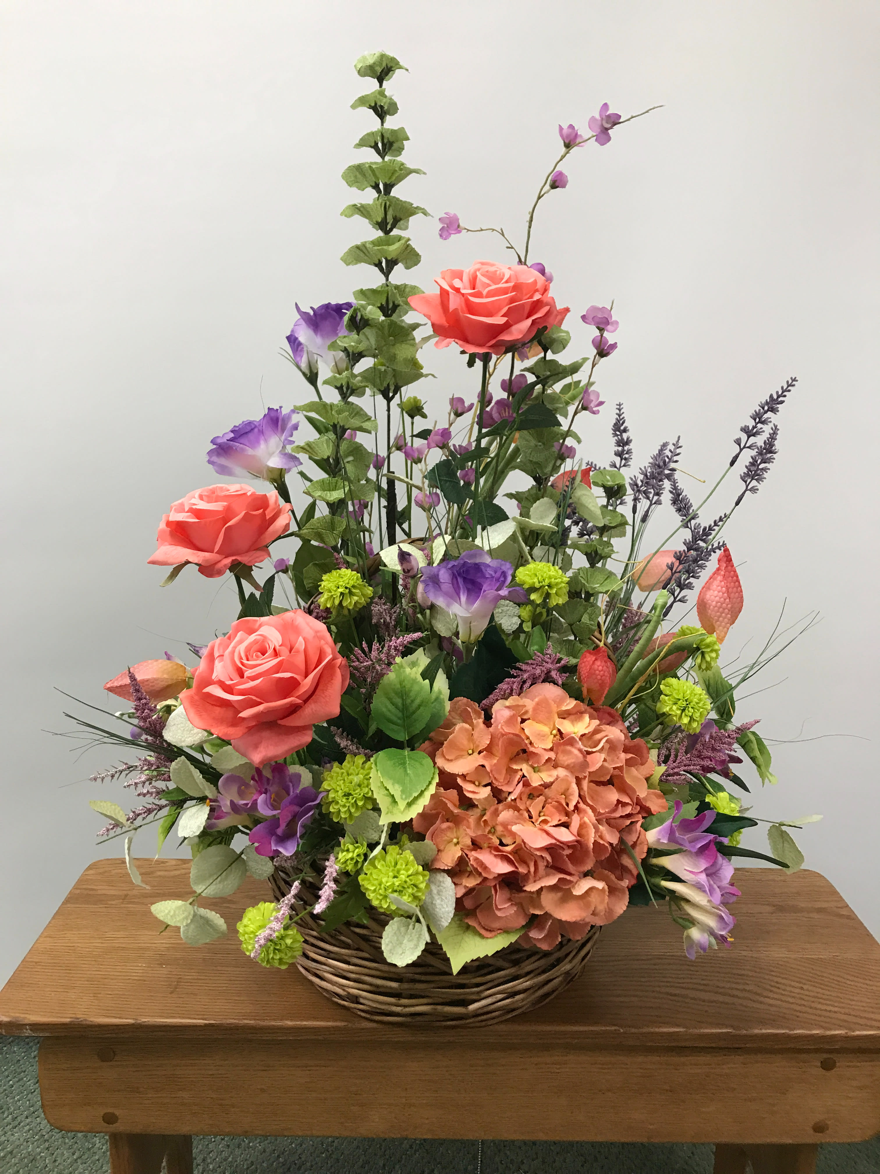 Silk Garden Basket Silk Garden Basket - Beautiful basket of assorted permanent botanicals in shades of peach, purple, and green.