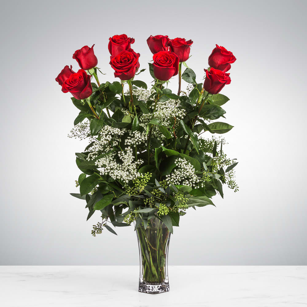 Dozen Long Stemmed Roses  - These dozen red roses with baby's breath are classic! Perfect romantic gift for Valentine's Day or an Anniversary.   APPROXIMATE DIMENSIONS: 25&quot; H X 18&quot; W