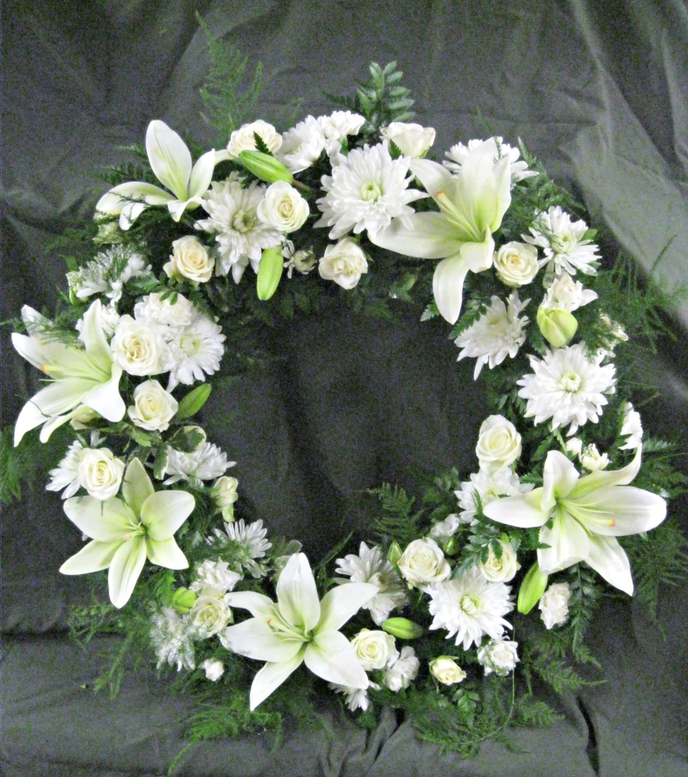 Peace and Serenity Wreath Peace and Serenity Wreath - Peace and serenity expressed in an allwhite traditional wreath.